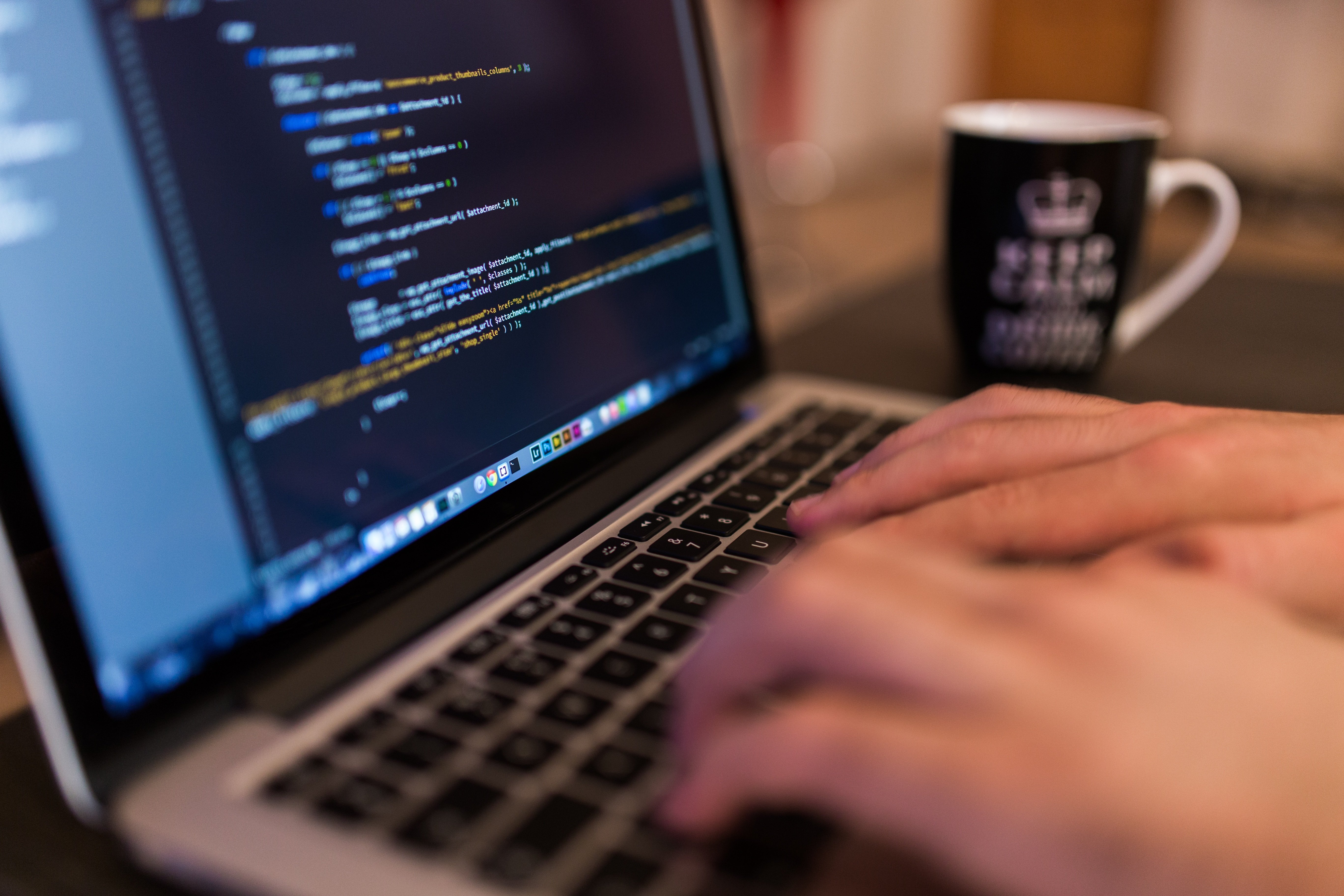 A person typing code at a computer, representing the AI skills in demand